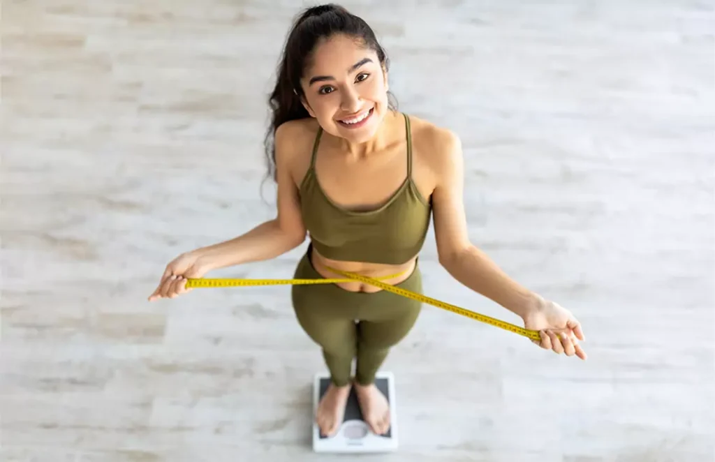 Indian Female Measuring Waist While